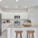 a kitchen with a marble island