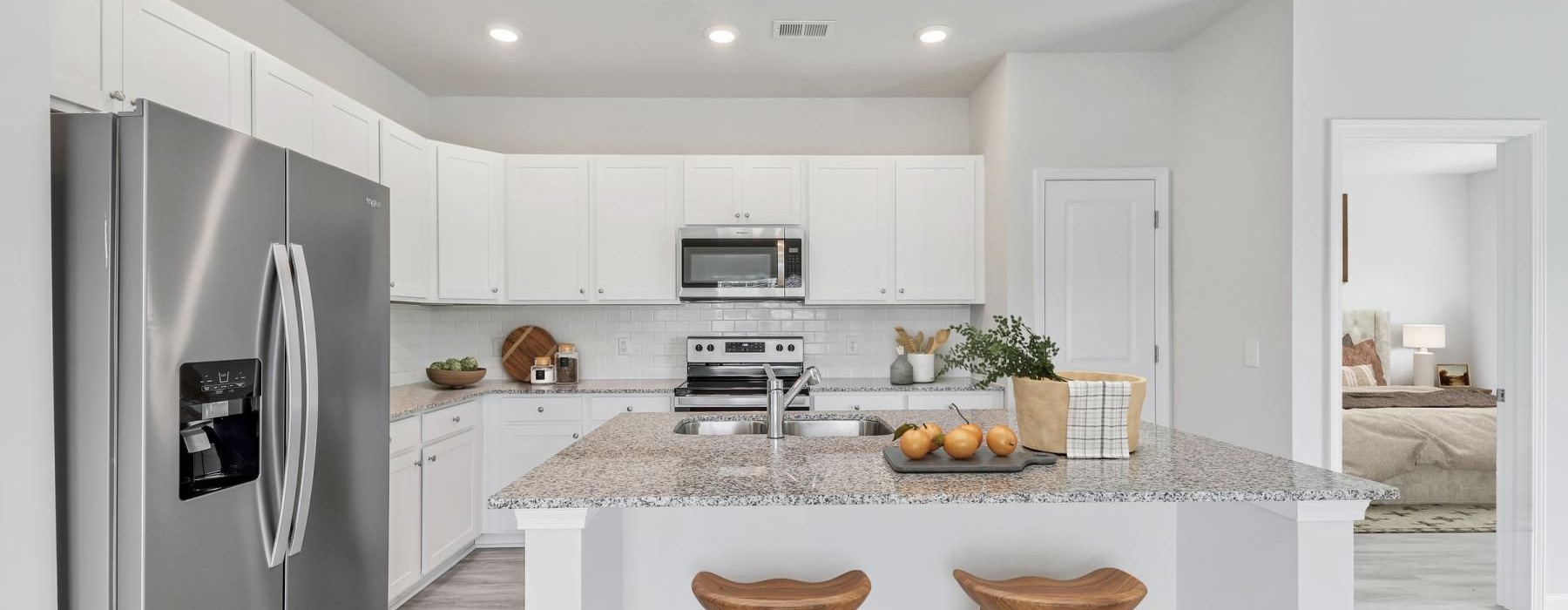 a kitchen with a marble island